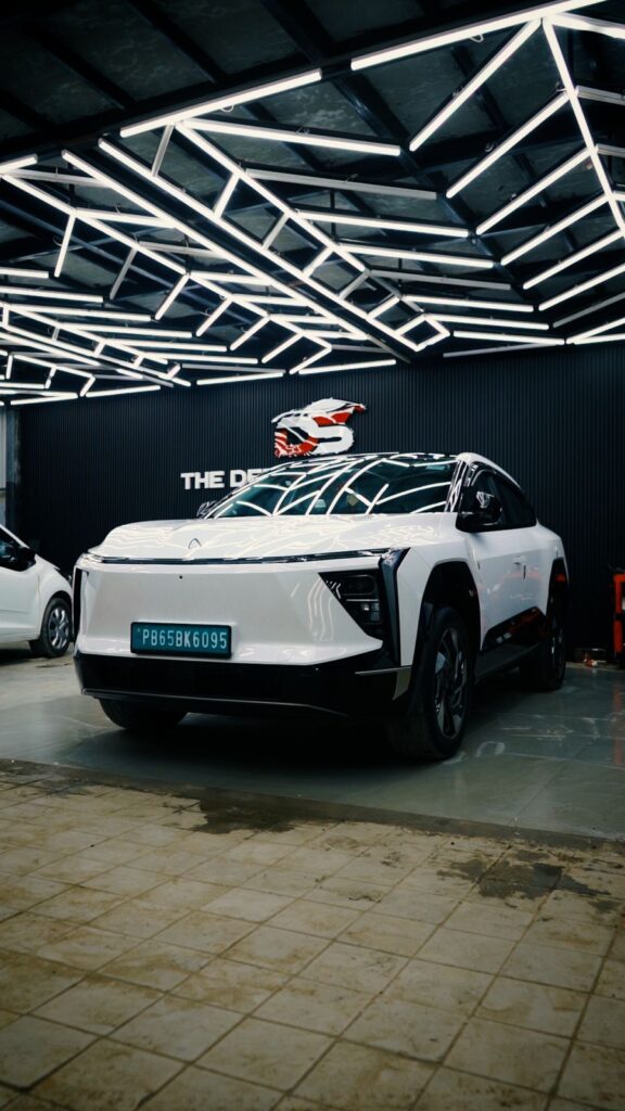 Premium SUV detailed under LED inspection lighting at The Detailing Square, showcasing smooth paint finish and surface clarity.